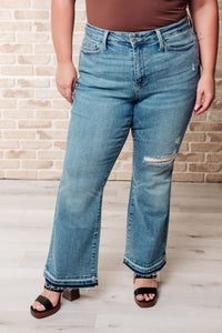 Isla Judy Blue Mid Rise Distressed Released Hem Bootcut Jeans