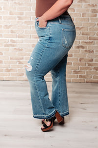 Isla Judy Blue Mid Rise Distressed Released Hem Bootcut Jeans