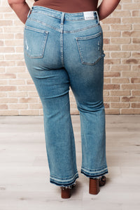 Isla Judy Blue Mid Rise Distressed Released Hem Bootcut Jeans