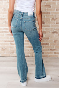 Isla Judy Blue Mid Rise Distressed Released Hem Bootcut Jeans